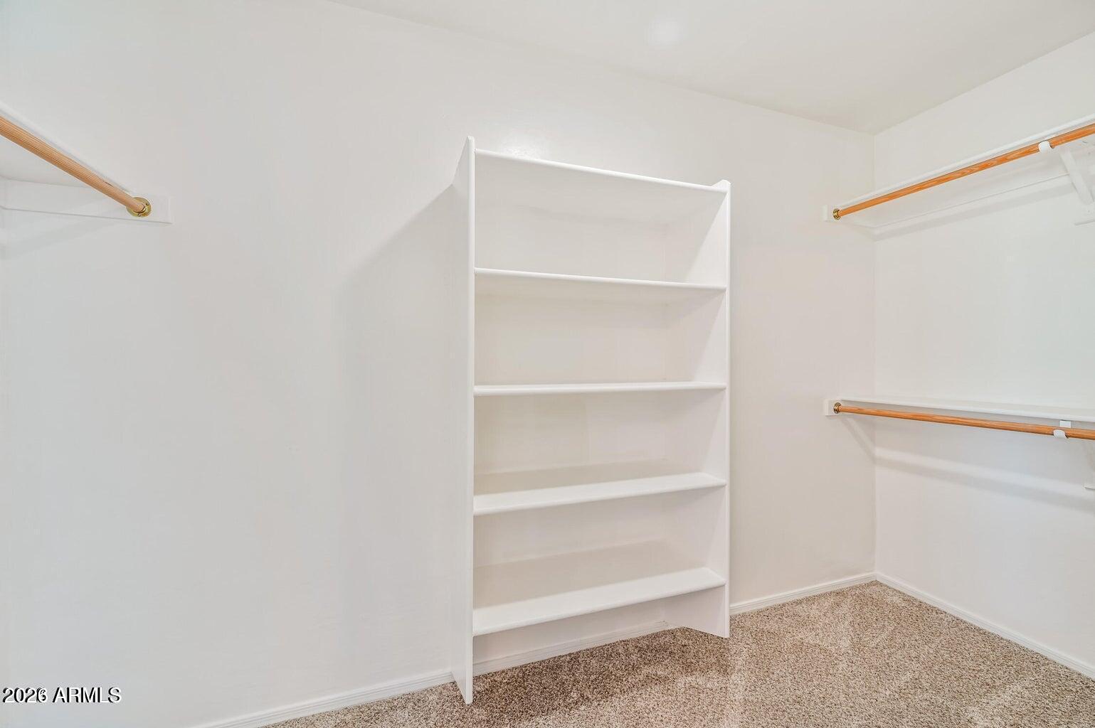 7809 South 20th Lane Phoenix, AZ 85041 - Photo 24 of 31 a view of an empty walk in closet