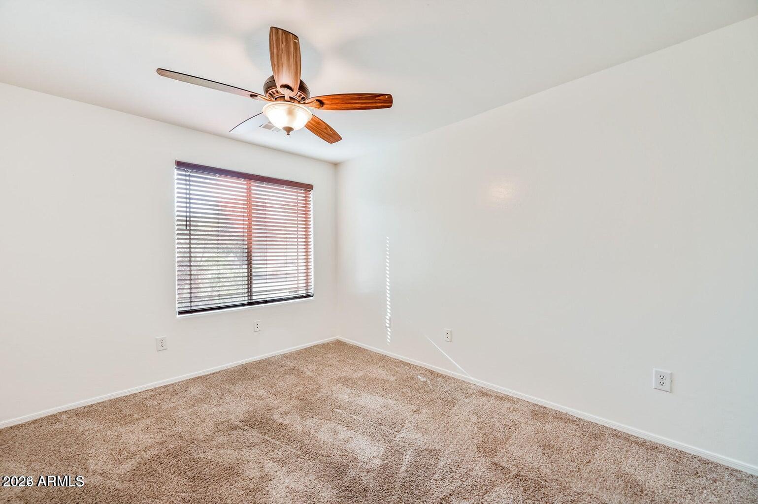 7809 South 20th Lane Phoenix, AZ 85041 - Photo 26 of 31 a view of a chandelier fan and a window