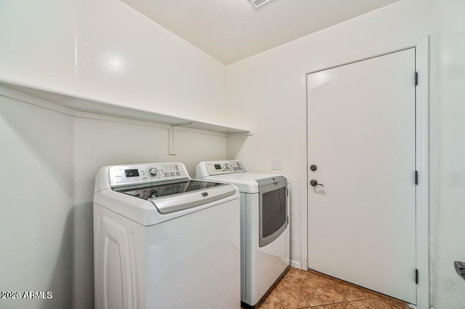 7809 South 20th Lane Phoenix, AZ 85041 - Photo 31 of 31 a room with storage and utility