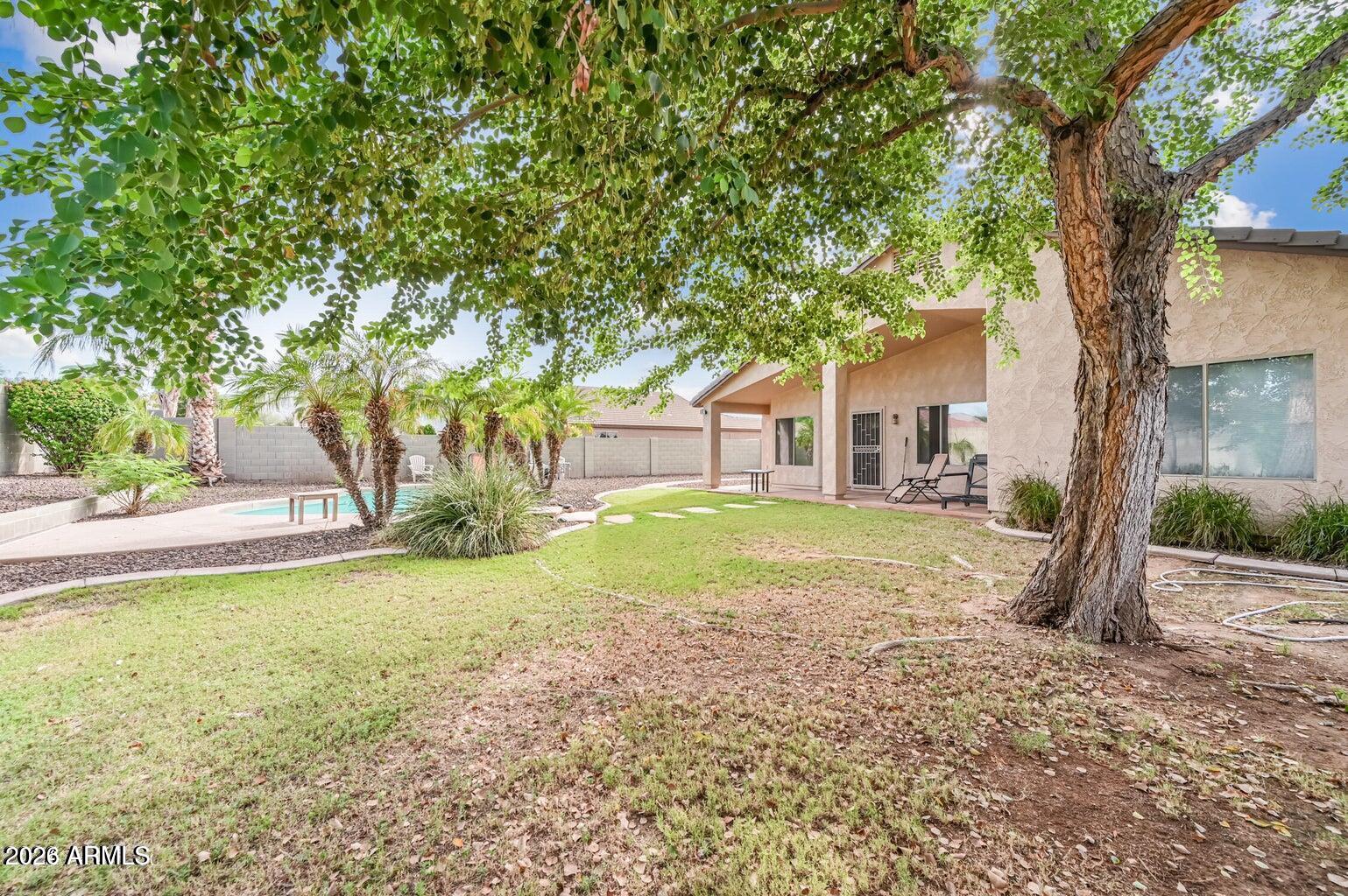 7809 South 20th Lane Phoenix, AZ 85041 - Photo 5 of 31 a house with trees in front of it