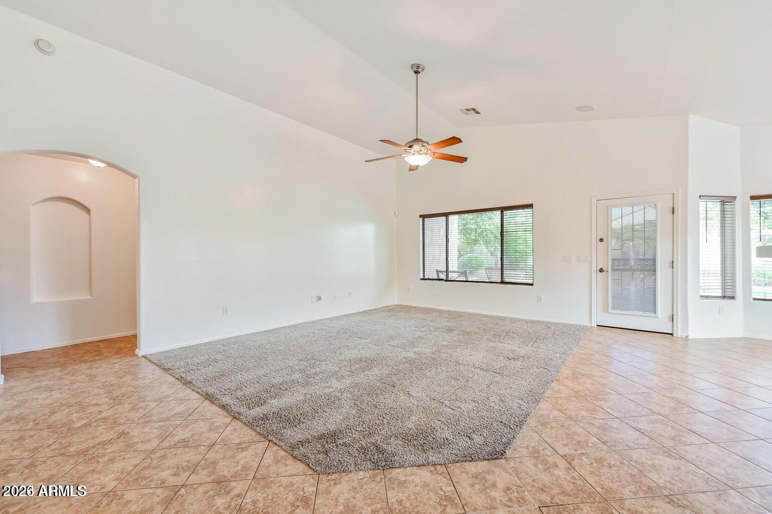 7809 South 20th Lane Phoenix, AZ 85041 - Photo 9 of 31 a view of an empty room with a window