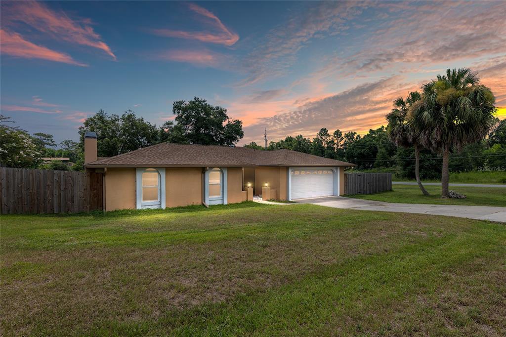 10427 Southwest 81st Terrace Road Ocala, FL 34481 - Photo 1 of 1 a front view of a house with a yard