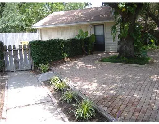 a front view of a house with a yard and a garage