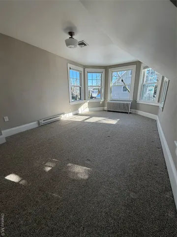 a view of empty room with windows