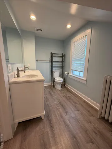 a view of kitchen with wooden floor and chair