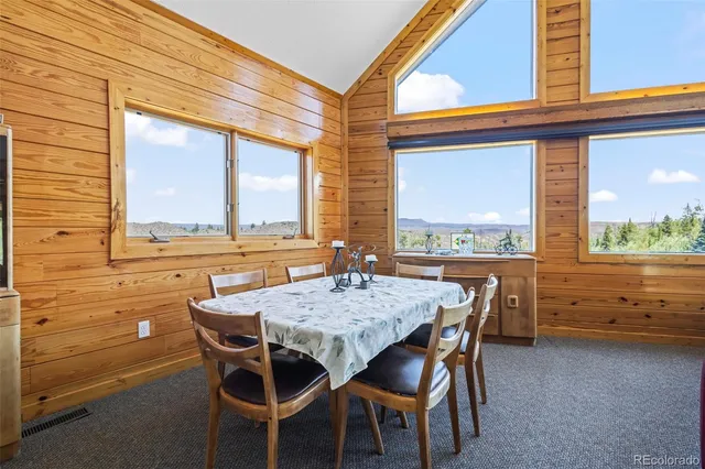 a view of a dining table and chairs in the room
