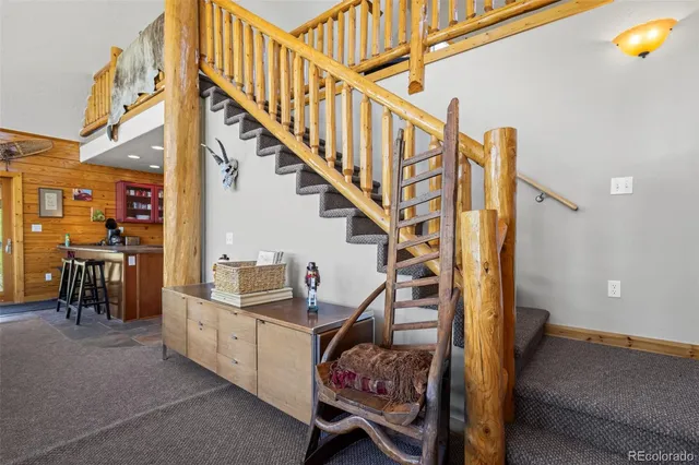 a view of entryway bedroom and hall with wooden floor