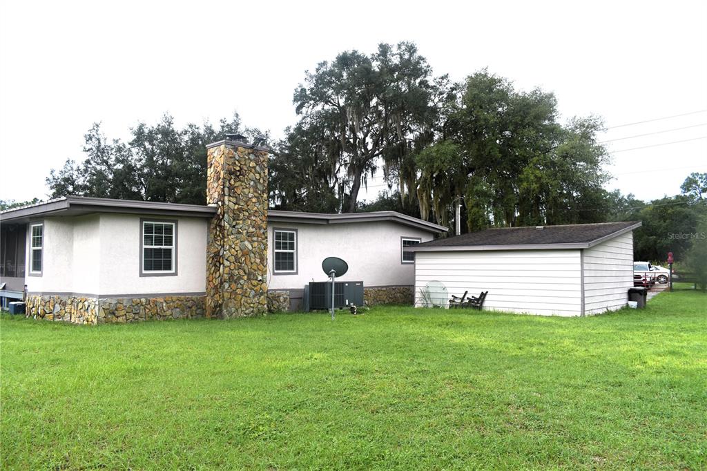 15355 Southwest 85th Avenue Dunnellon, FL 34432 - Photo 2 of 23 a view of a house with a yard and sitting area