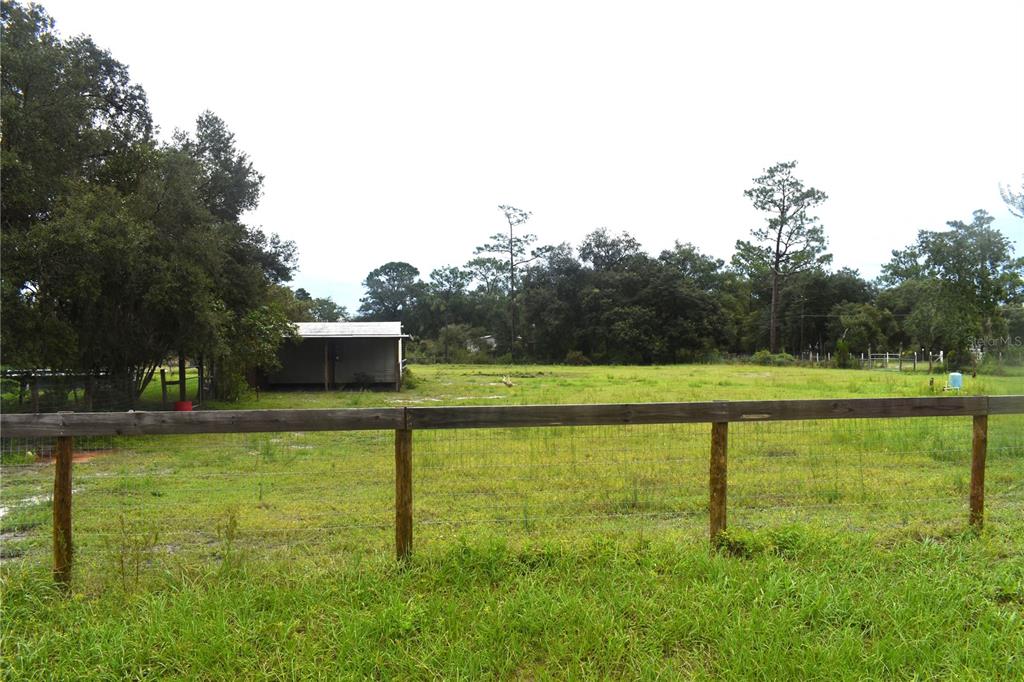 15355 Southwest 85th Avenue Dunnellon, FL 34432 - Photo 21 of 23 a view of a swimming pool with a yard