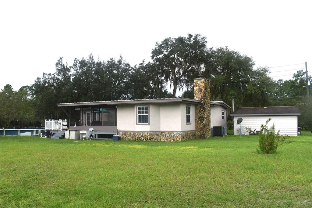 15355 Southwest 85th Avenue Dunnellon, FL 34432 - Photo 4 of 23 a front view of house with yard and green space