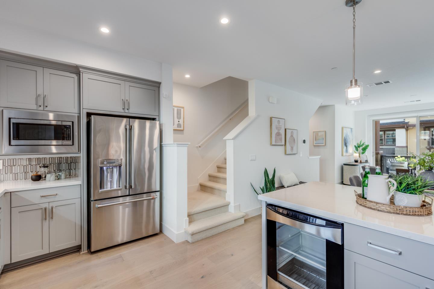 309 Marquetta Circle Mountain View, CA 94043 - Photo 14 of 34 a kitchen with white cabinets and stainless steel appliances