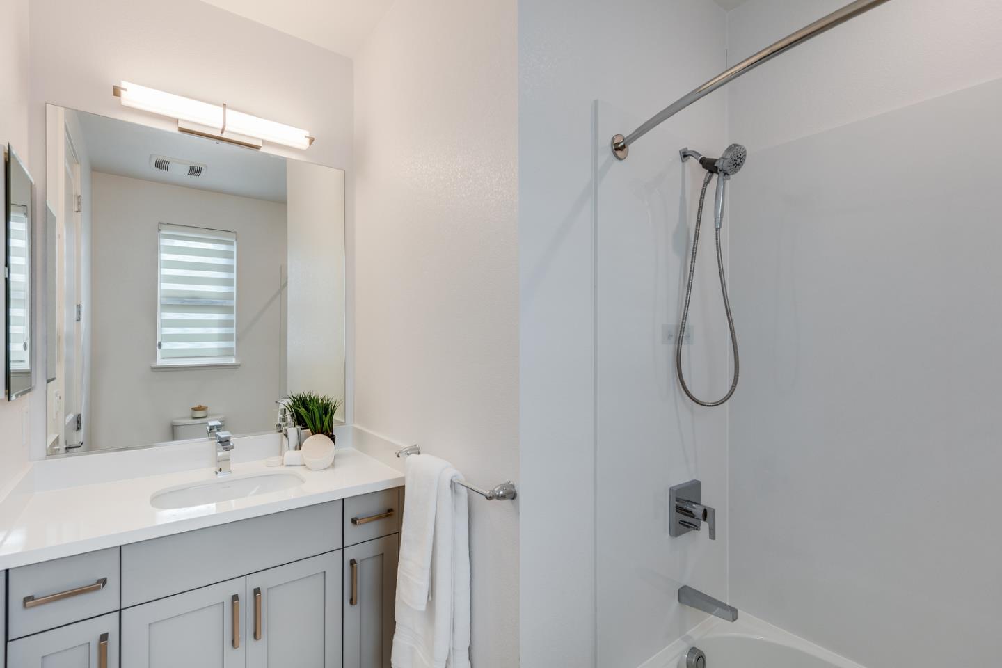 309 Marquetta Circle Mountain View, CA 94043 - Photo 22 of 34 a bathroom with a granite countertop sink a shower and a mirror