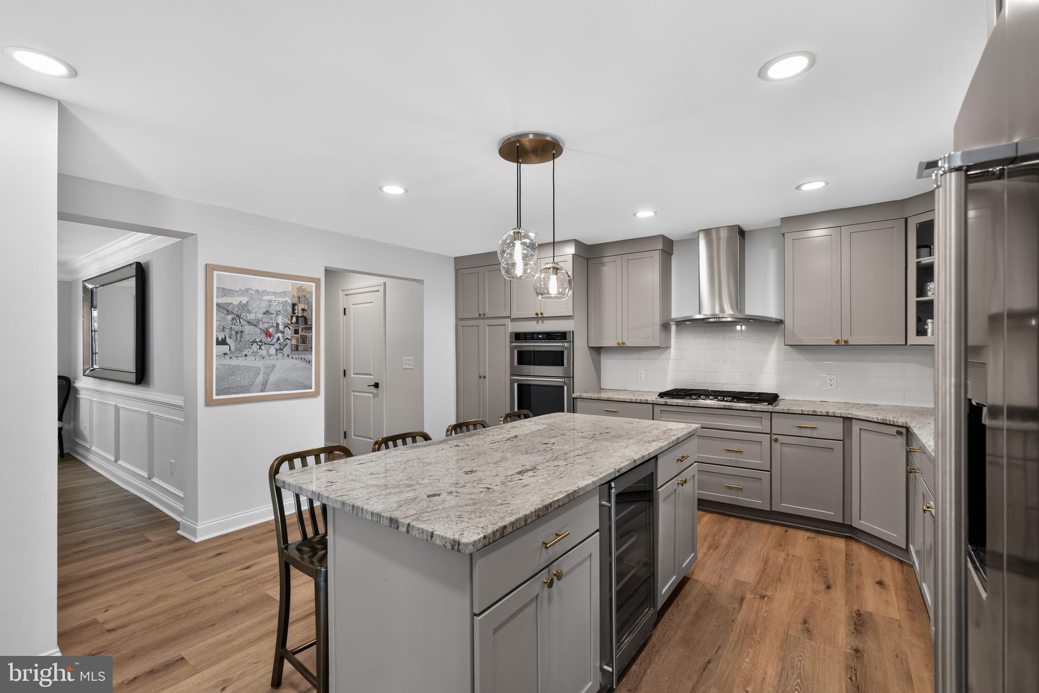 39 Crestline Road Wayne, PA 19087 - Photo 16 of 56 Kitchen island with wine refigerator