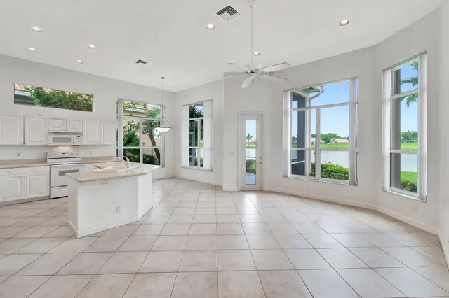 a bathroom with a bathtub shower sink and mirror