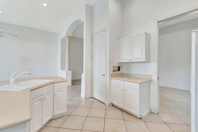 a aerial view of a house with a yard and potted plants