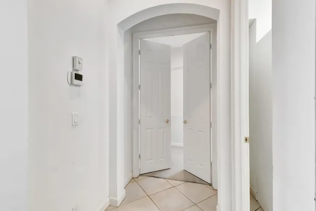 an aerial view of residential houses with yard and lake view