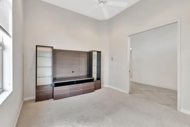 an aerial view of a house with outdoor space and lake view