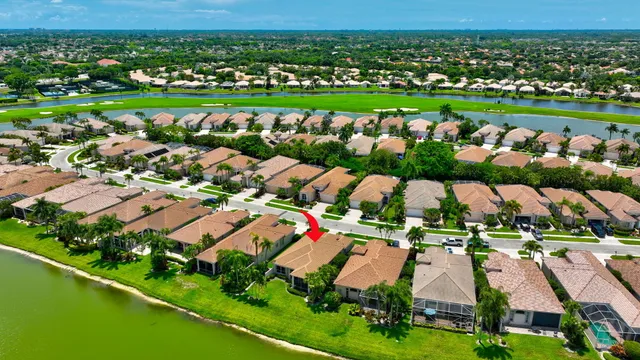 a room with lots of wooden furniture a large window and furniture