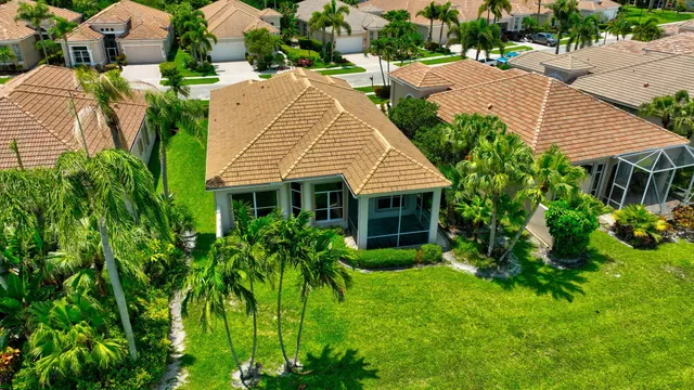 an aerial view of a house with a garden