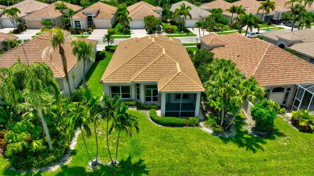 a living room with lots of furniture and kitchen view