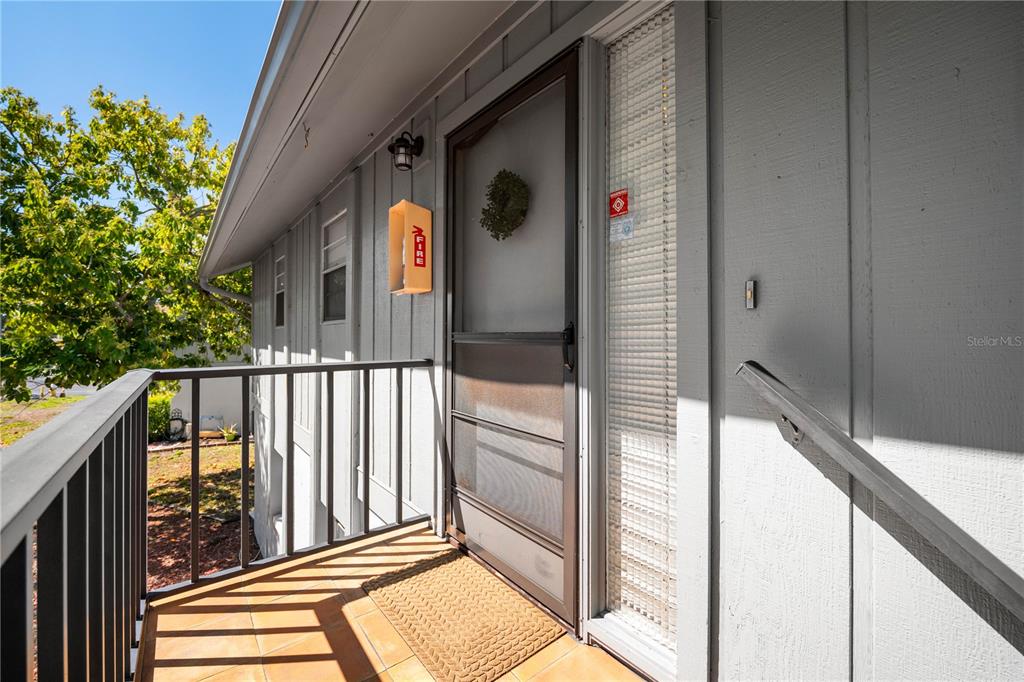 a view of a balcony with a potted plant