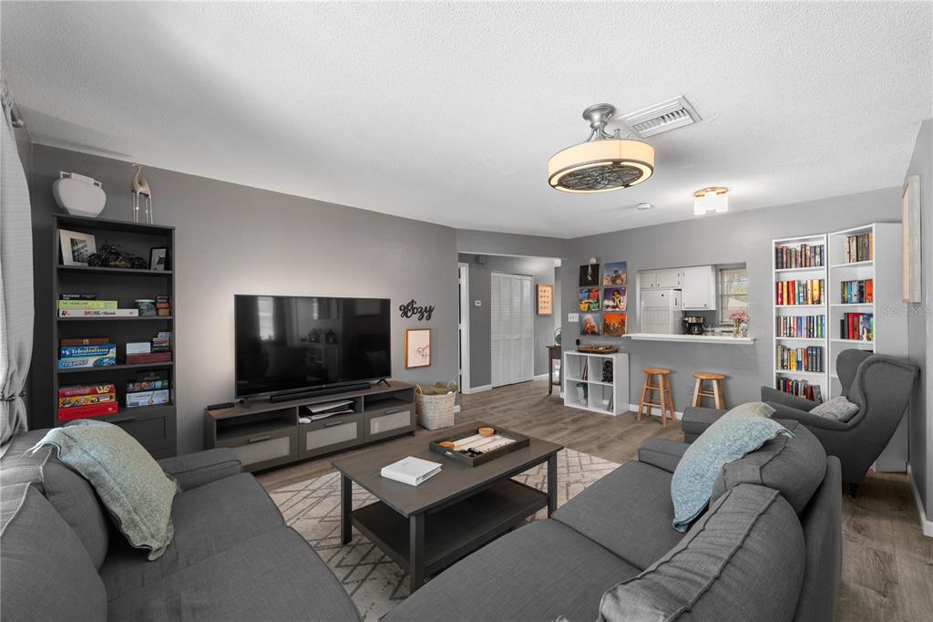1960 Union Street, Unit 28 Clearwater, FL 33763 - Photo 2 of 23 a living room with furniture and a flat screen tv