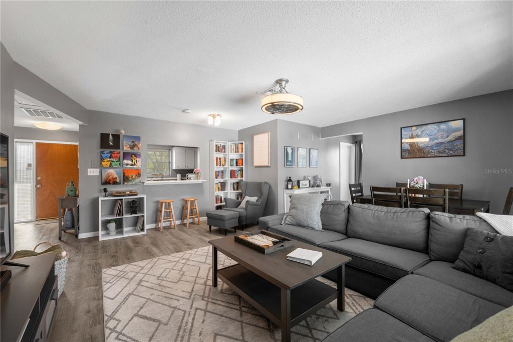 1960 Union Street, Unit 28 Clearwater, FL 33763 - Photo 3 of 23 a living room with furniture and a flat screen tv