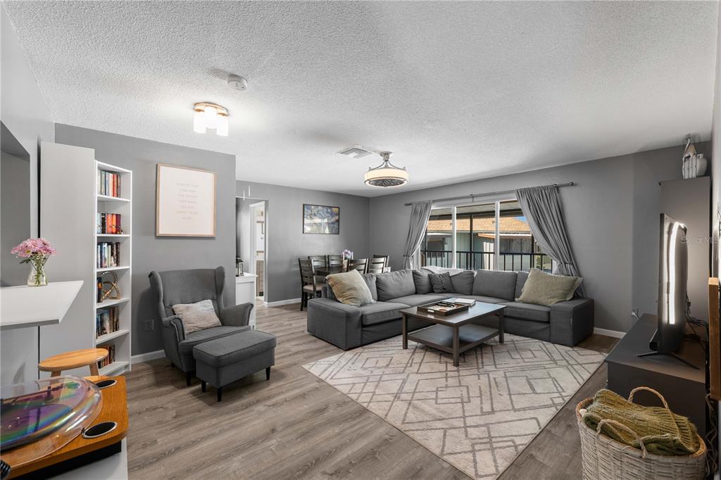 1960 Union Street, Unit 28 Clearwater, FL 33763 - Photo 4 of 23 a living room with furniture and a large window
