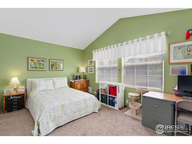 a bedroom with a bed furniture and a window