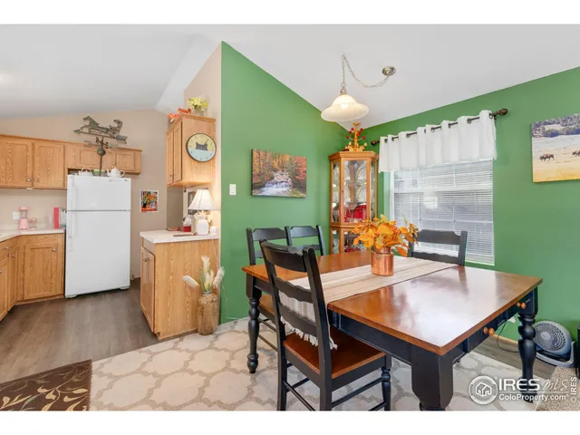 a dining room with a table and chairs