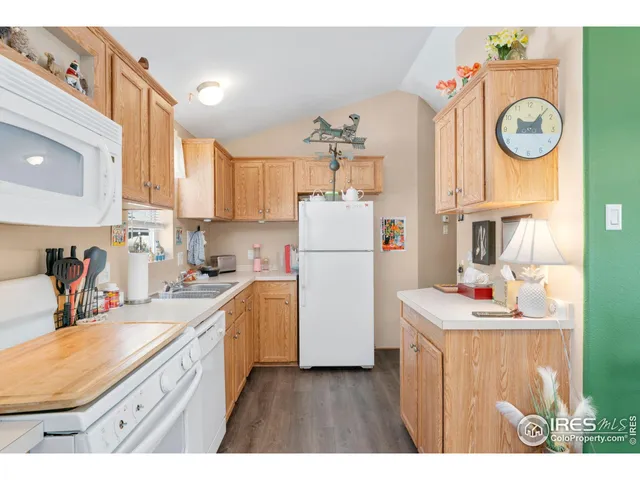 a kitchen that has a sink and a stove