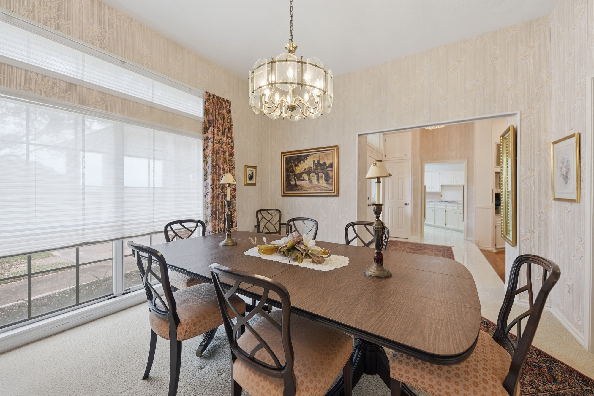 1552 Holub Road Schulenburg, TX 78956 - Photo 8 of 45 Formal dining room offers classic wallpaper and soft lighting combined with natural lighting for all gatherings.