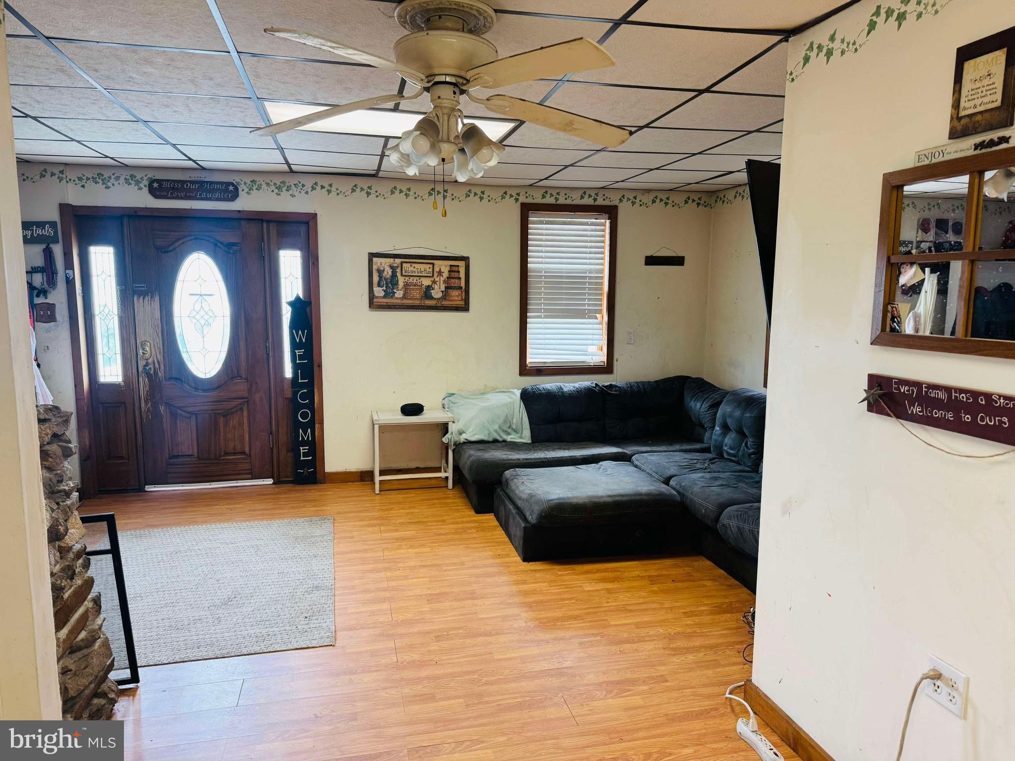 4617 Upper Road Shamokin, PA 17872 - Photo 2 of 16 a living room with furniture and a chandelier
