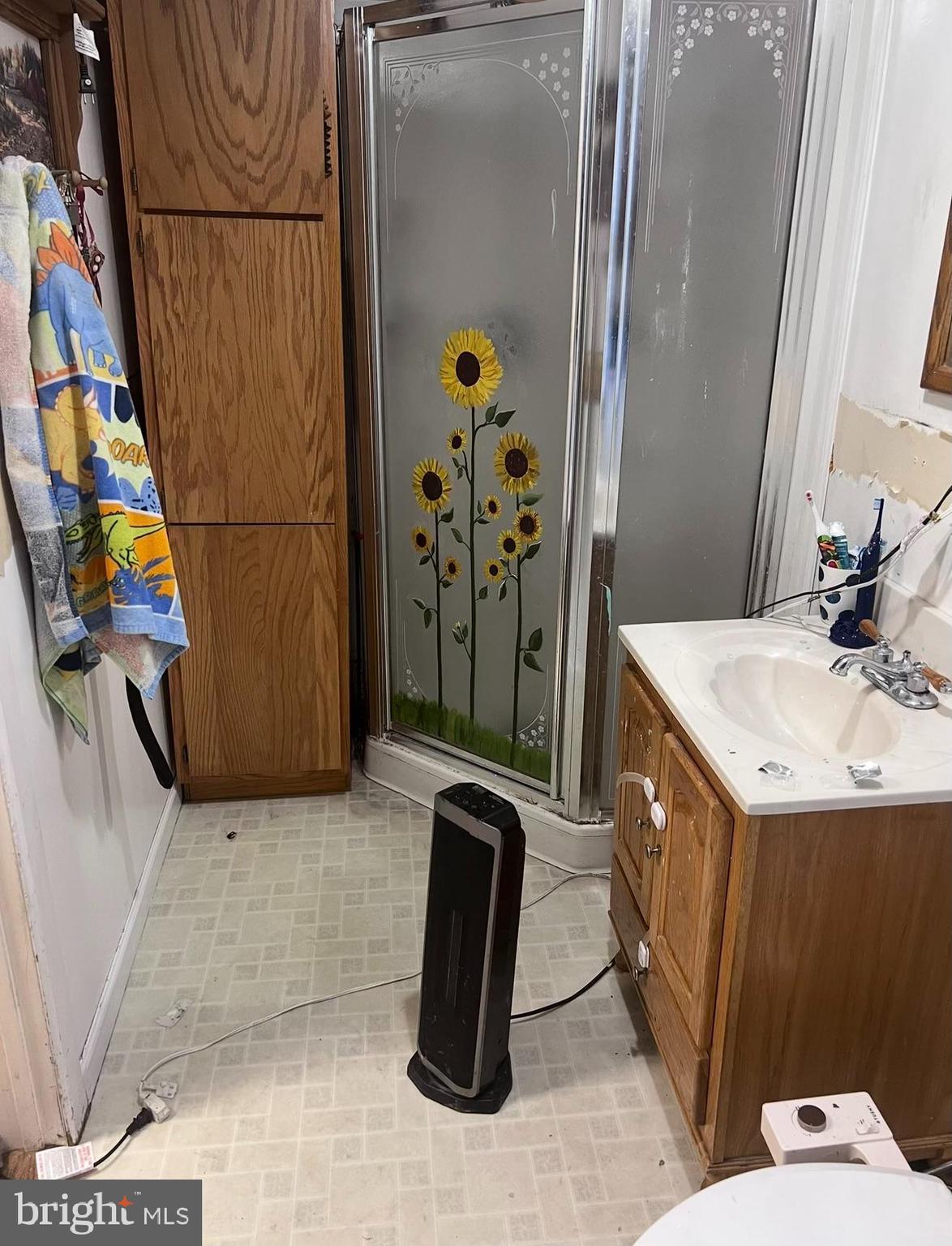 4617 Upper Road Shamokin, PA 17872 - Photo 8 of 16 a bathroom with a sink a toilet and shower