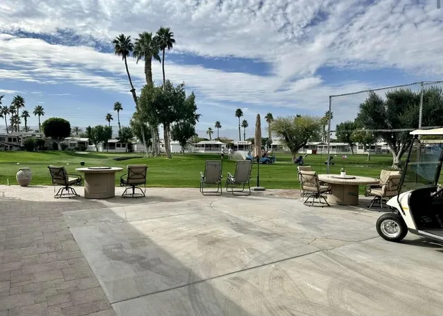 a view of a bench in front of a house