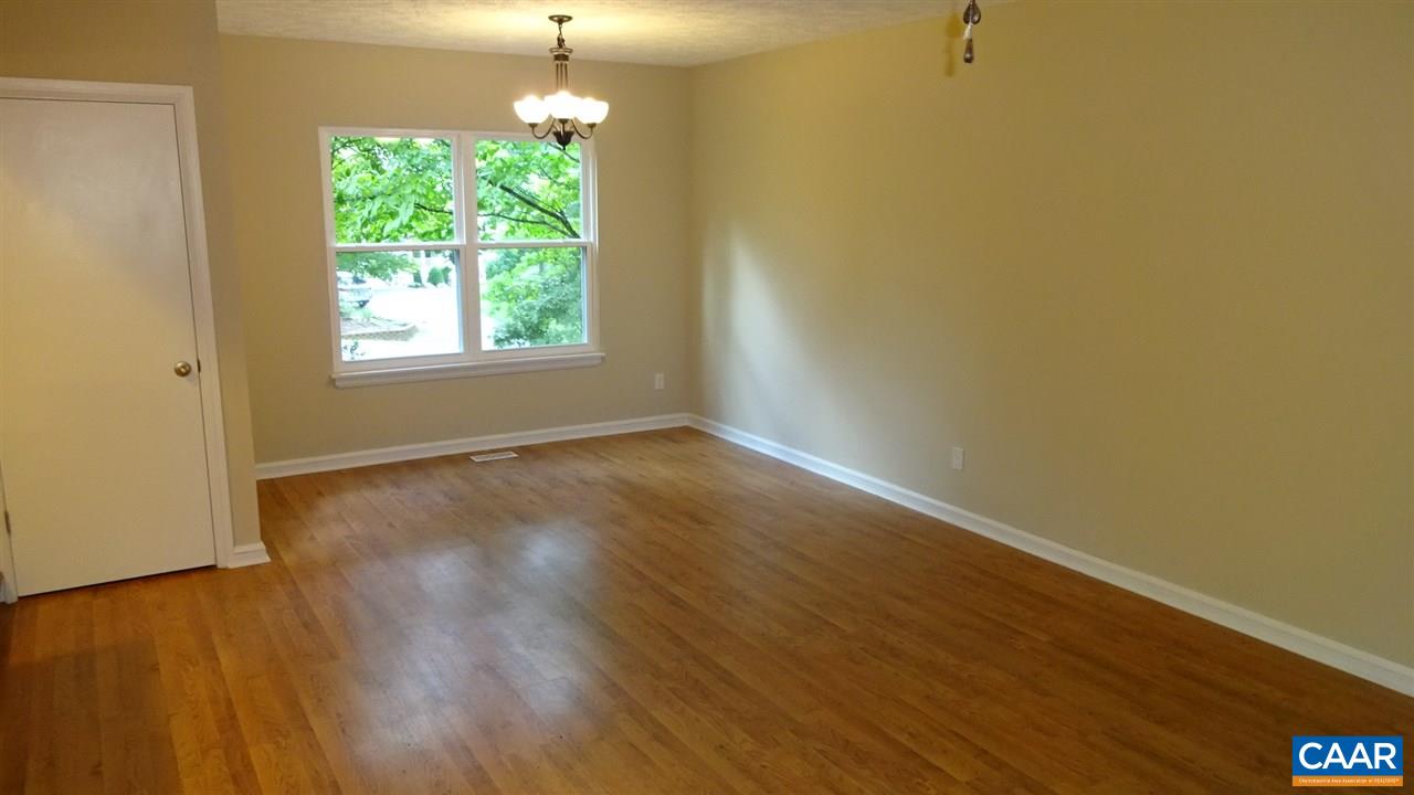 12 Ashton Road Palmyra, VA 22963 - Photo 3 of 25 an empty room with wooden floor and windows