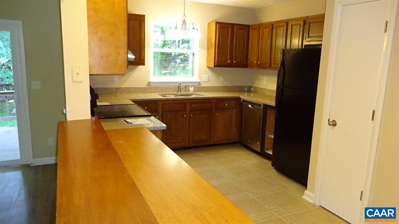 12 Ashton Road Palmyra, VA 22963 - Photo 6 of 25 a kitchen with a sink and a refrigerator