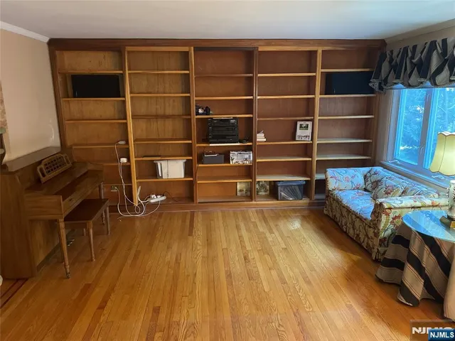 a room with furniture and a book shelf