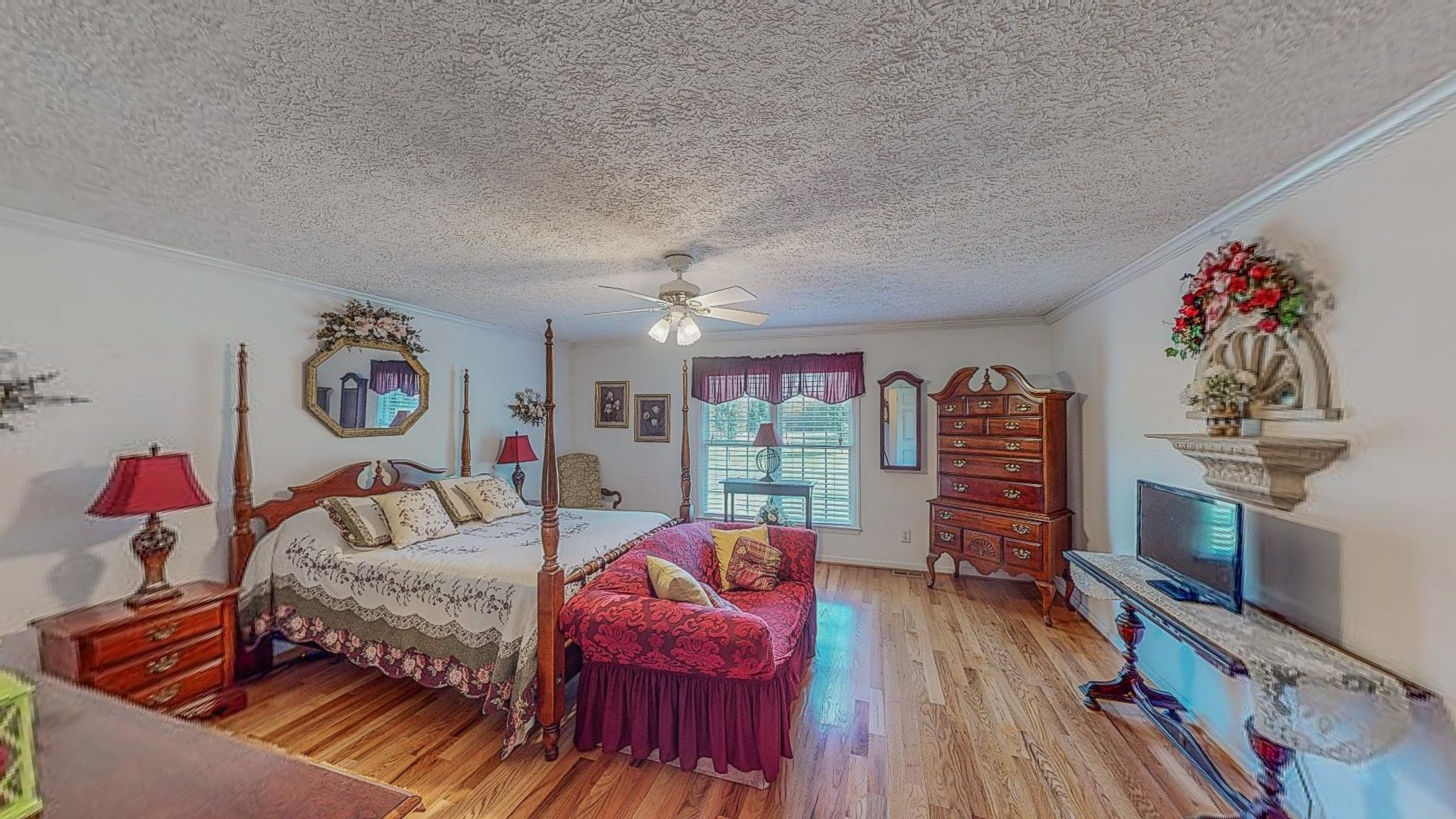 17 Richland Road Roxboro, NC 27574 - Photo 28 of 63 a bedroom with furniture and a wooden floor