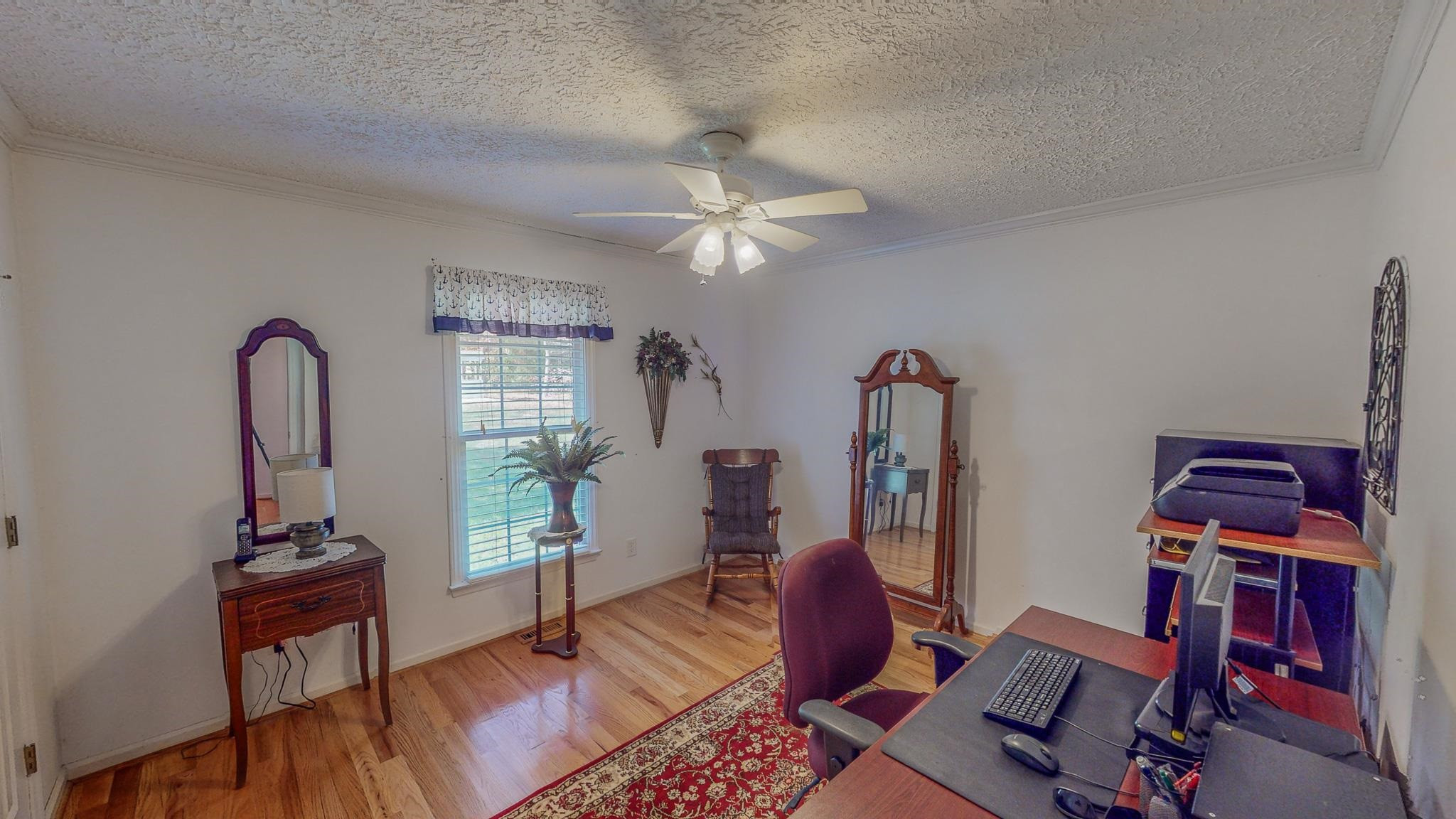 17 Richland Road Roxboro, NC 27574 - Photo 35 of 63 a view of a workspace with furniture and a window
