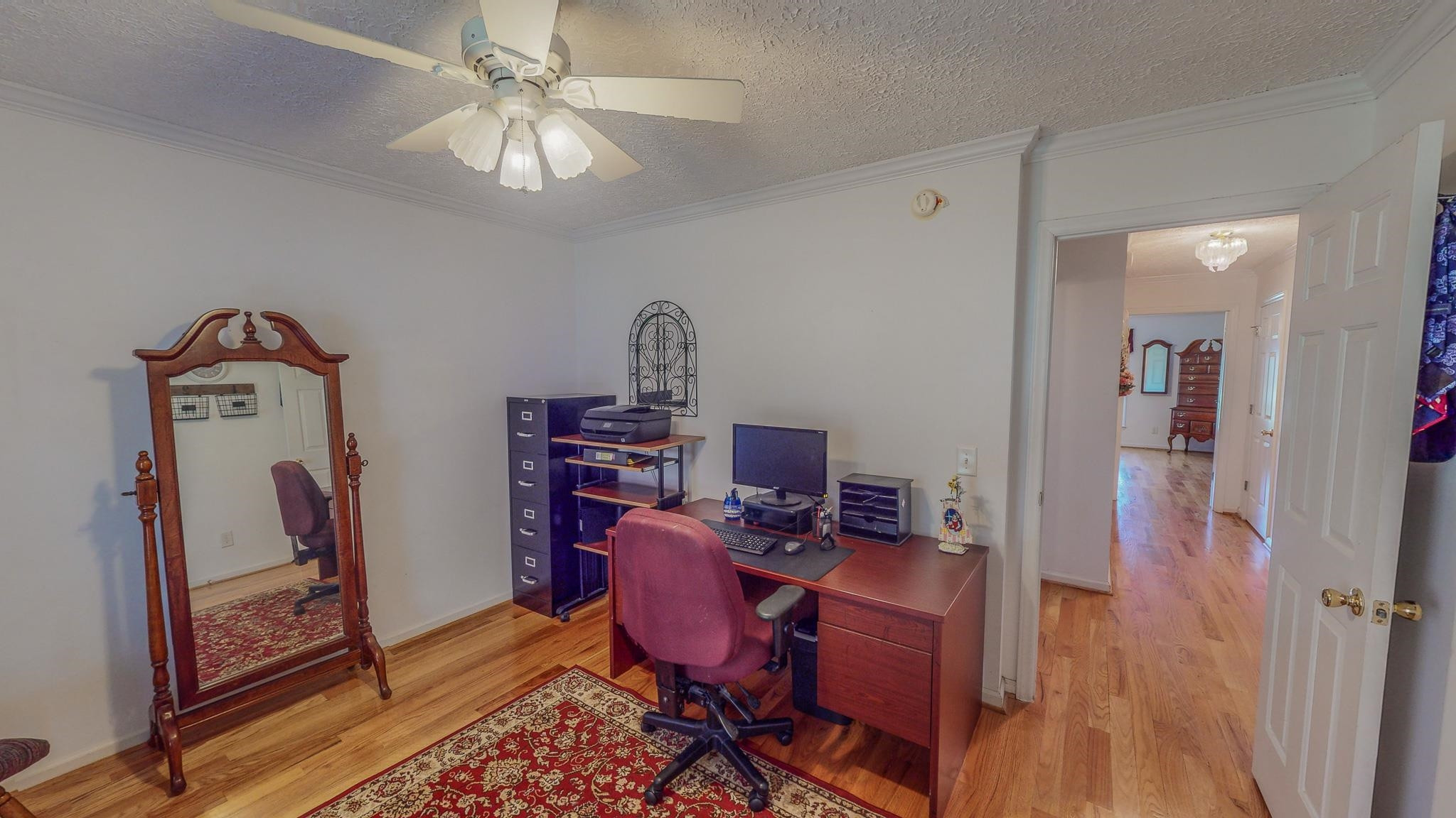 17 Richland Road Roxboro, NC 27574 - Photo 36 of 63 a view of a workspace with furniture and wooden floor