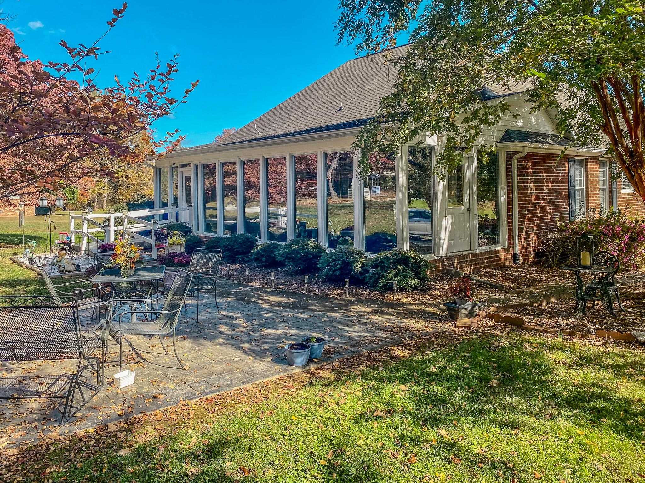 17 Richland Road Roxboro, NC 27574 - Photo 39 of 63 a view of a house with backyard sitting area and garden