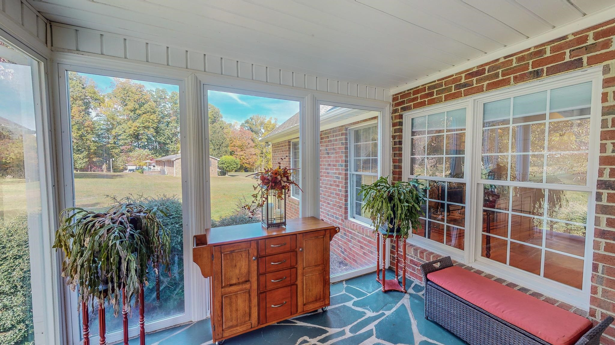 17 Richland Road Roxboro, NC 27574 - Photo 46 of 63 a living room filled with furniture and a potted plant