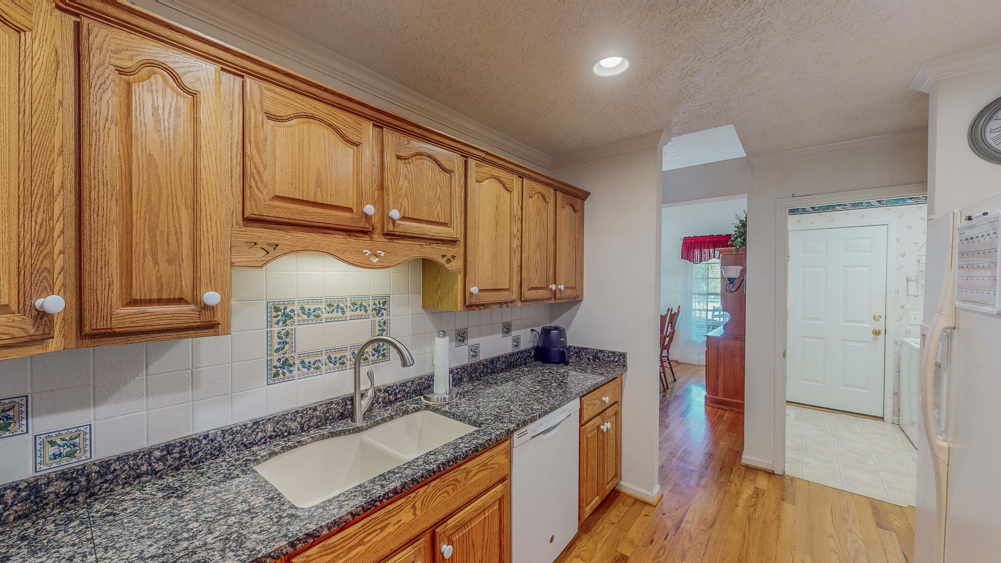 17 Richland Road Roxboro, NC 27574 - Photo 49 of 63 a kitchen with granite countertop a sink stove and cabinets