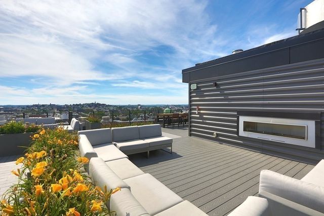 a living room with furniture a car and window