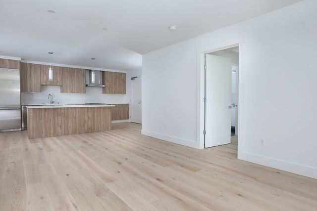 a view of kitchen with wooden floor
