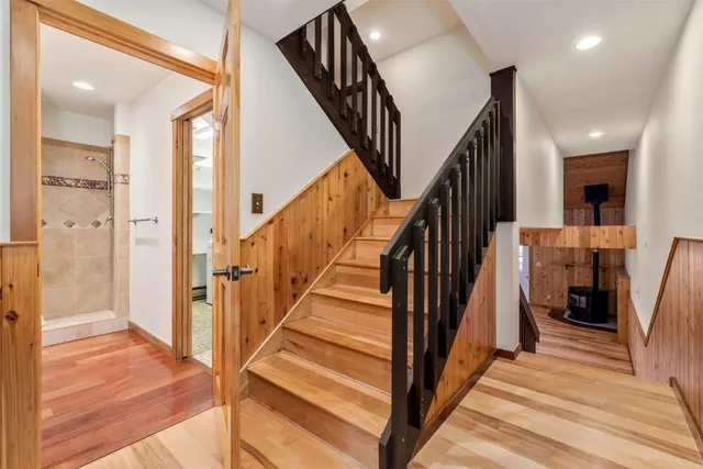 a kitchen with granite countertop wooden floors and stainless steel appliances