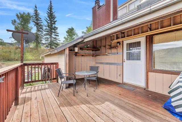 a view of balcony with wooden floor and outdoor seating