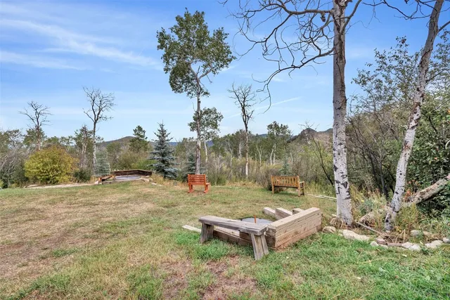 a view of a house with backyard porch and sitting area