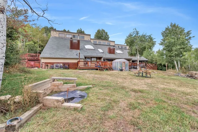 a backyard of a house with lots of green space